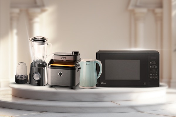 An electric kettle is being used in the kitchen.